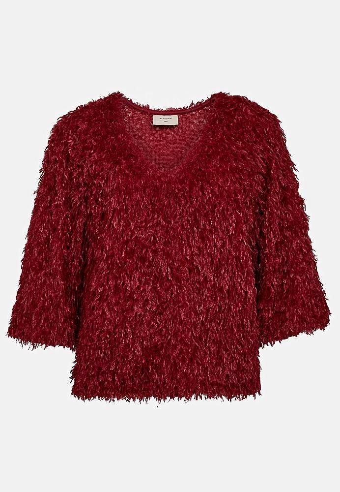 Festtop med fjerlignende materiale