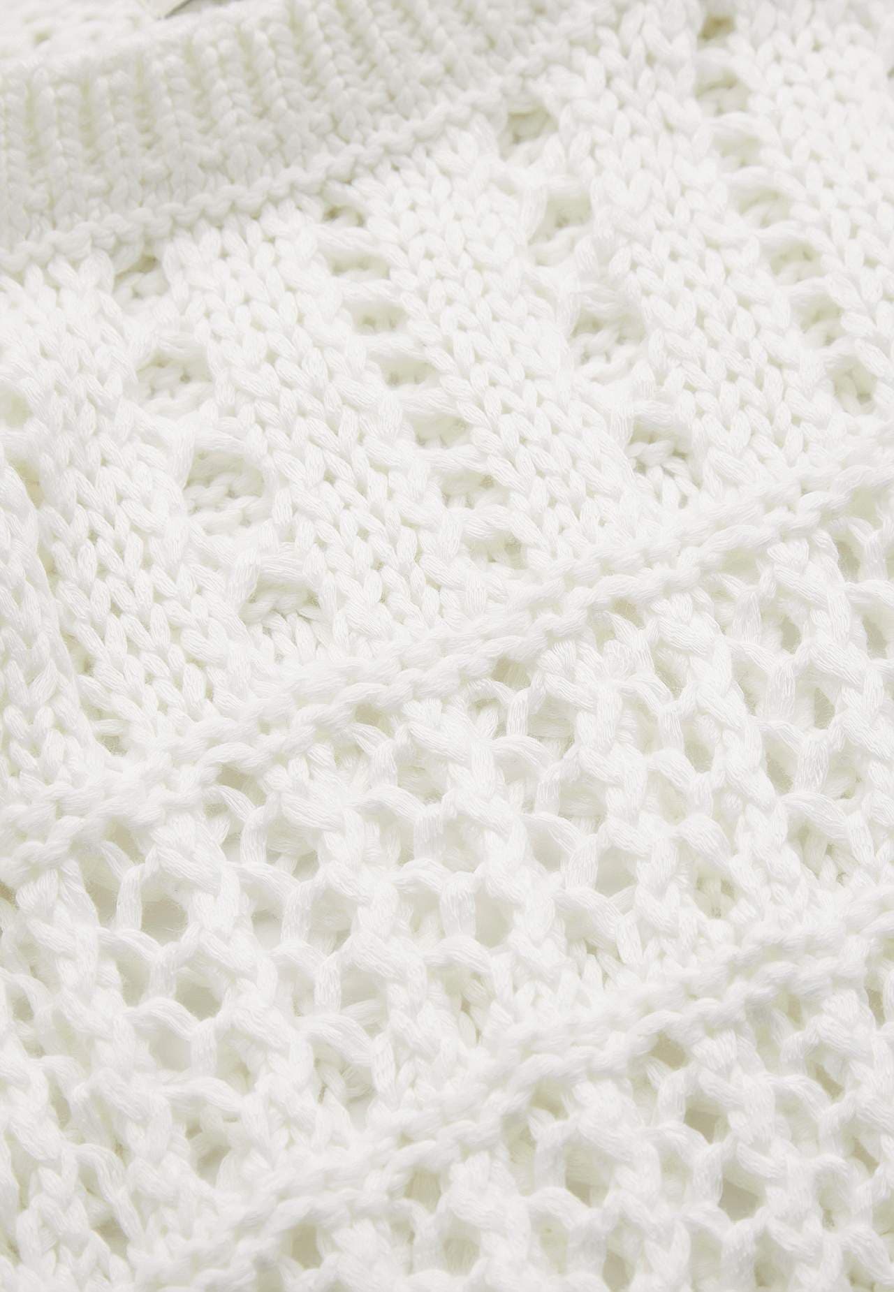 Strikket trøje med hulmønster