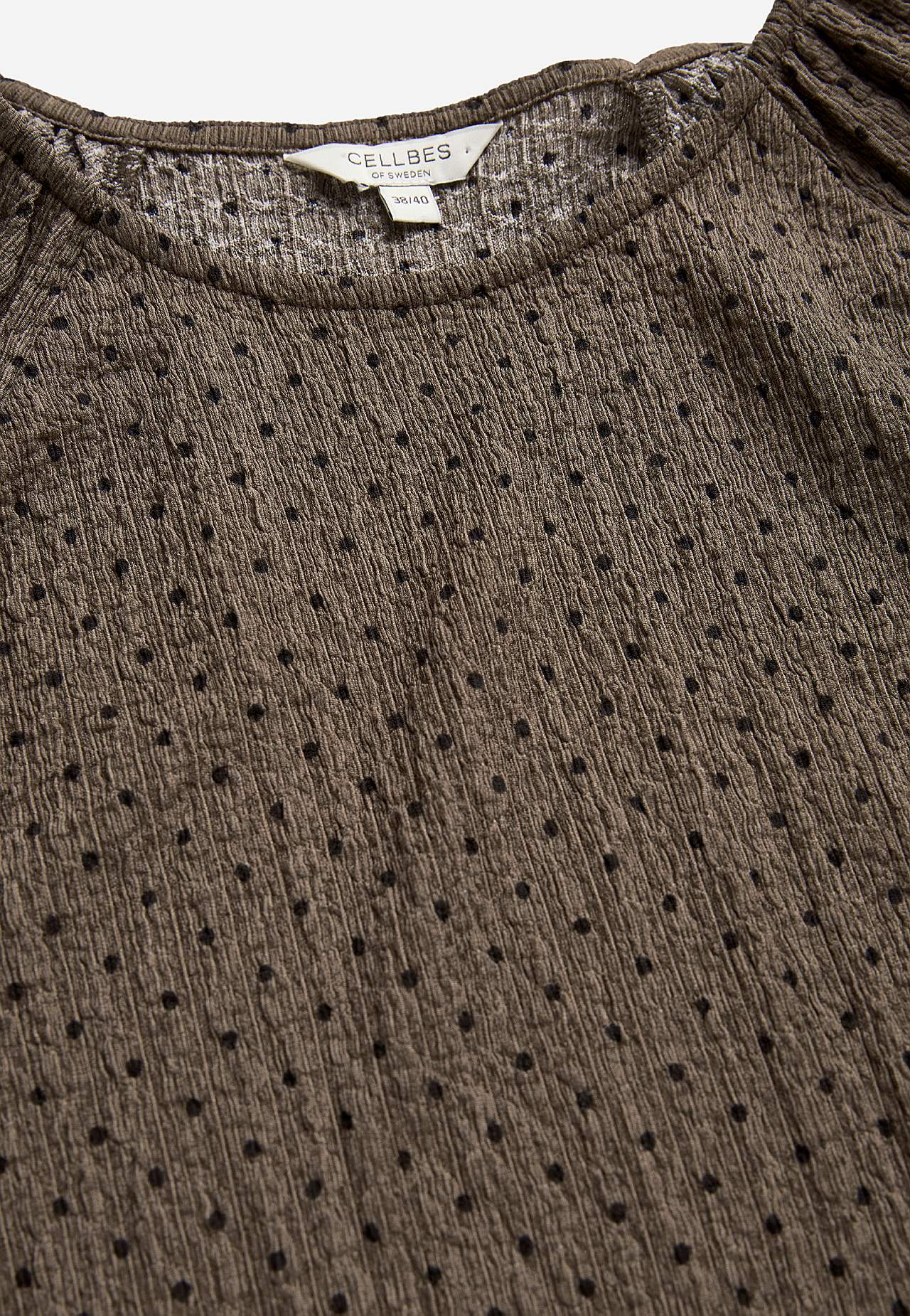Prikket top med elastisk crepe kvalitet