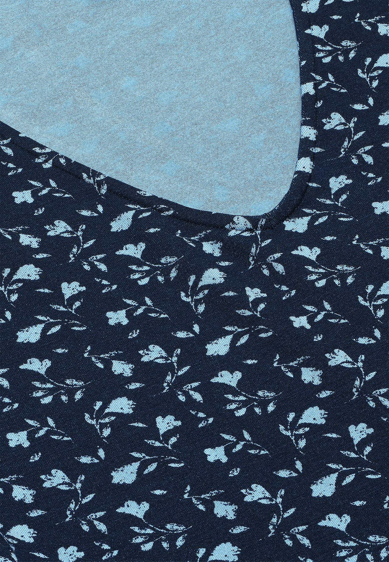 Jerseykjole med et blomstermønster og lommer