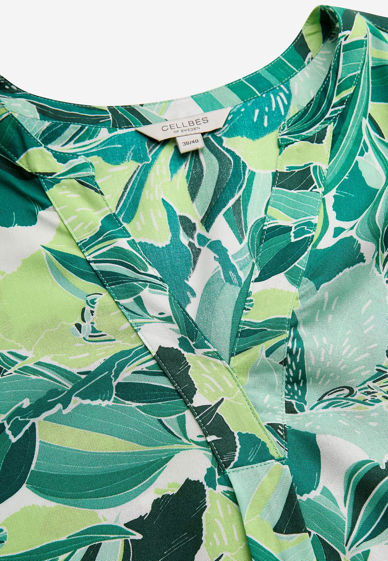 Ærmeløs tunika med lommer og et blomstermønster