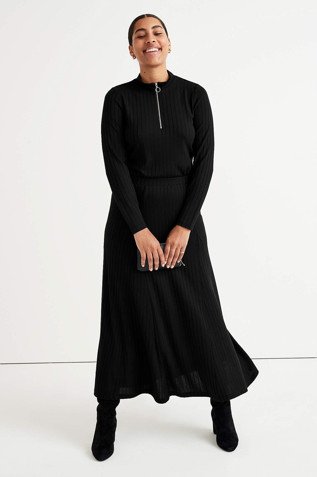 Ribbet tunikatop med lynlås og ståkrage