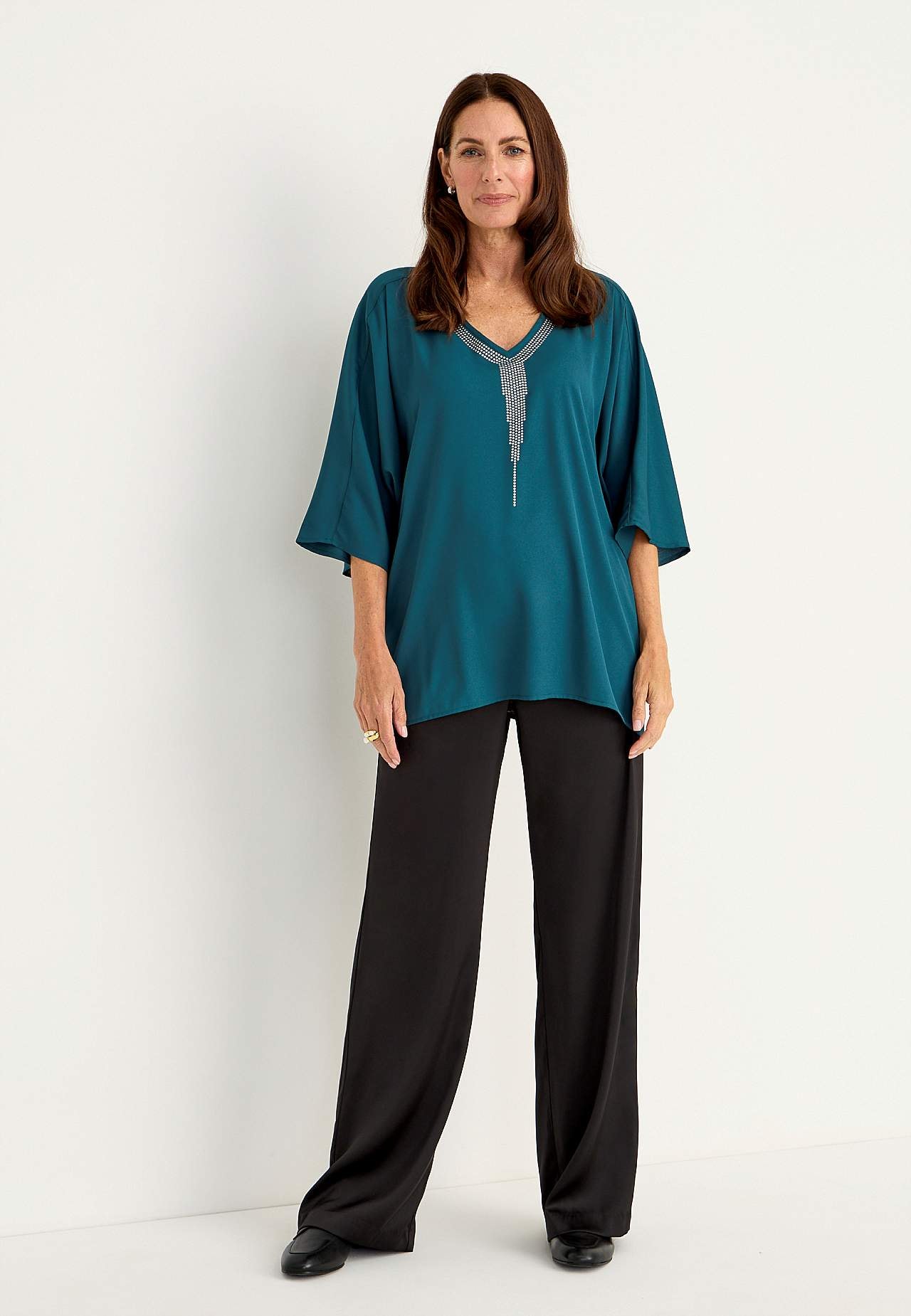 Festbluse med nittedetaljer