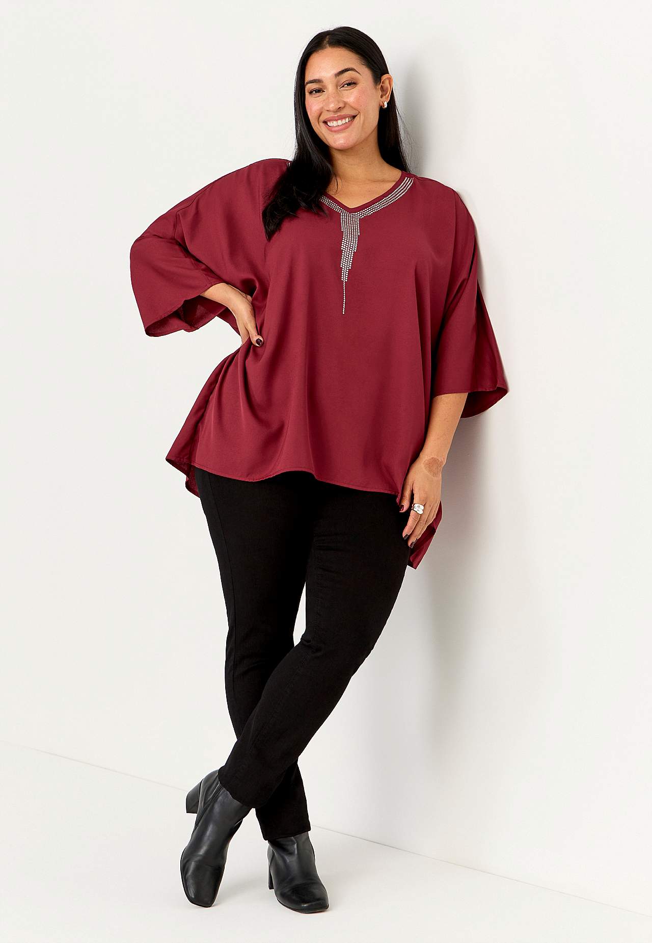 Festbluse med nittedetaljer