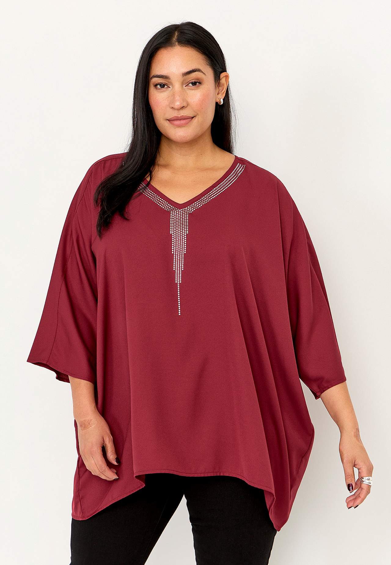 Festbluse med nittedetaljer