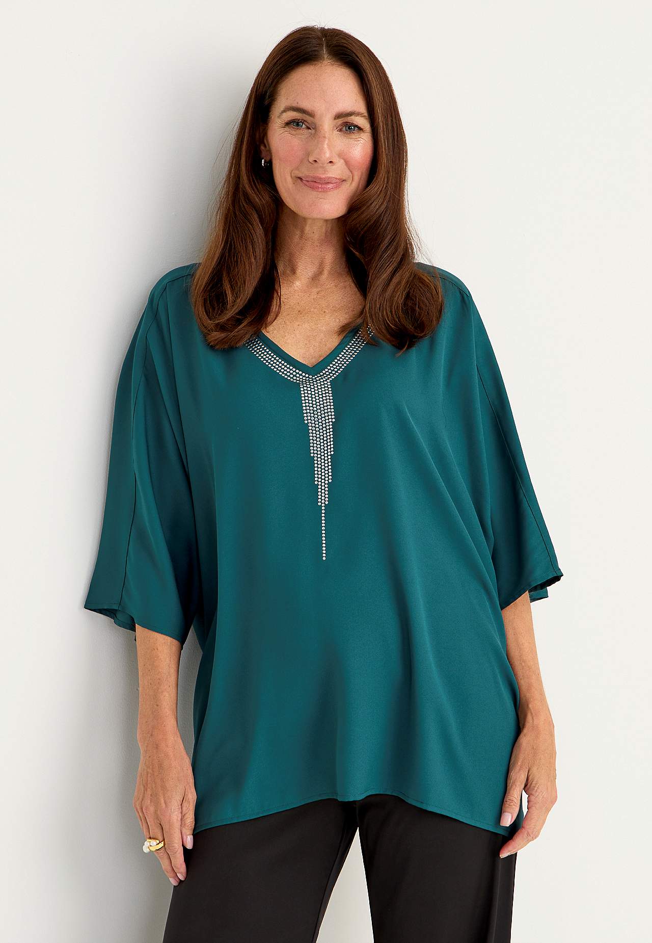 Festbluse med nittedetaljer