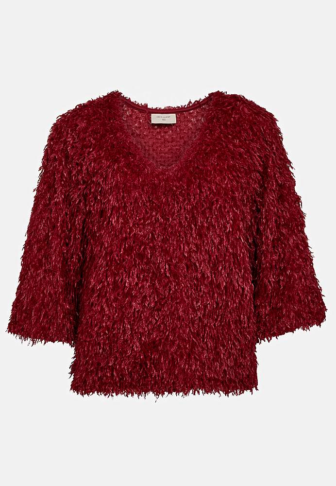 Festtop med fjerlignende materiale